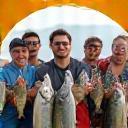 Group of friends holding up their catch